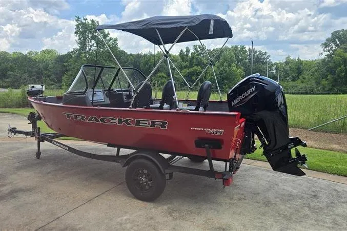 Slide: The Image of 2026 Tracker Pro Guide V-16 WT boat with Mercury engine on a trailer. - 5