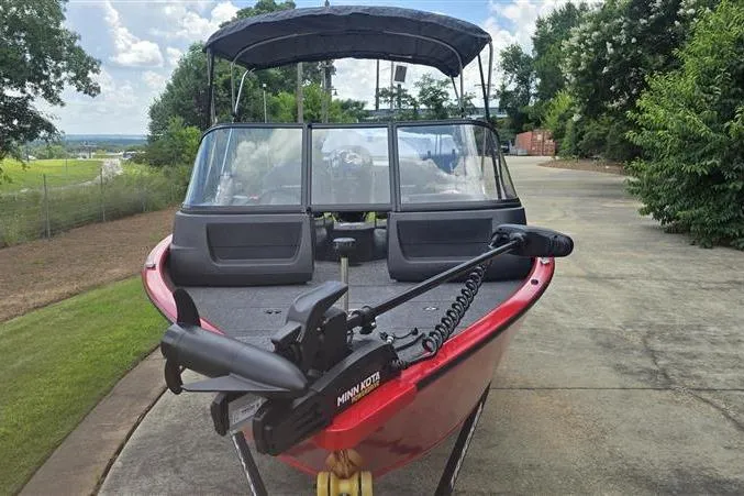 Slide: The Image of 2026 Tracker Pro Guide V-16 WT boat with canopy and Minn Kota trolling motor. - 3