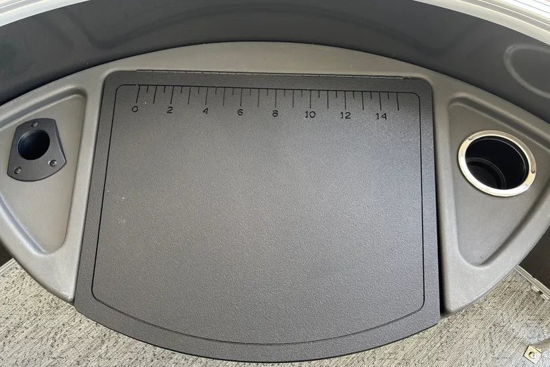 Slide: The Image of 2026 Sun Tracker Fishin' Barge 20 DLX fishing station with ruler and cup holder. - 32