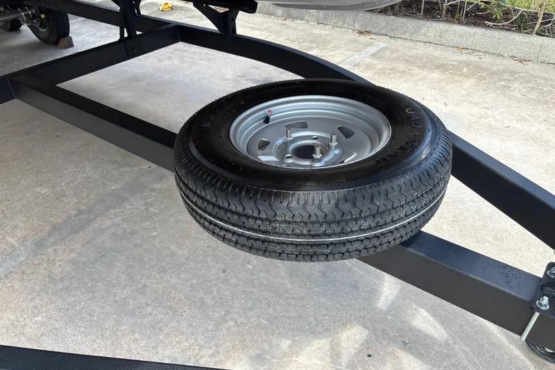 Slide: The Image of Spare tire mounted on a Sun Tracker Fishin' Barge 20 DLX trailer, 2026 model. - 43
