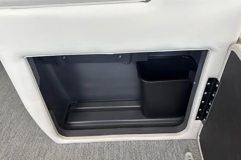 Slide: The Image of Storage compartment in 2026 Sun Tracker Fishin' Barge 20 DLX boat interior. - 29