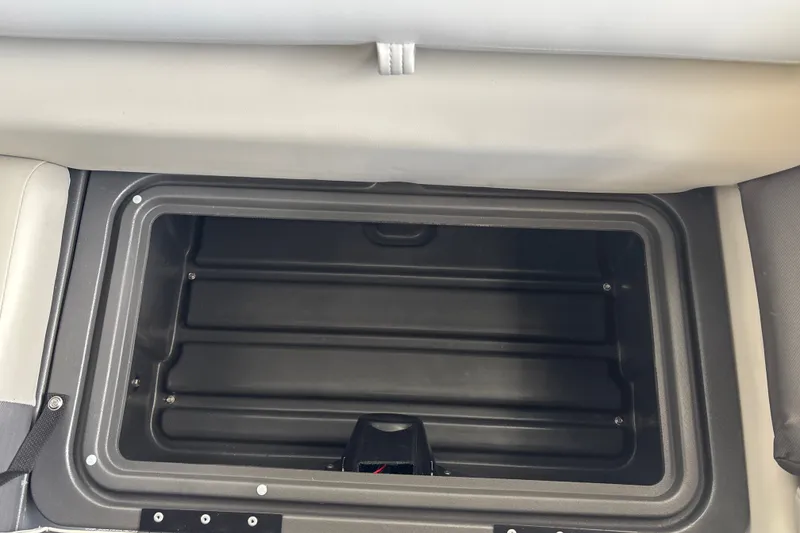 Slide: The Image of Storage compartment in 2026 Sun Tracker Fishin' Barge 20 DLX boat. - 36