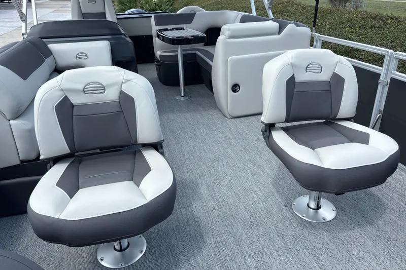 Slide: The Image of 2026 Sun Tracker Fishin' Barge 20 DLX interior with comfortable seating and modern design. - 14