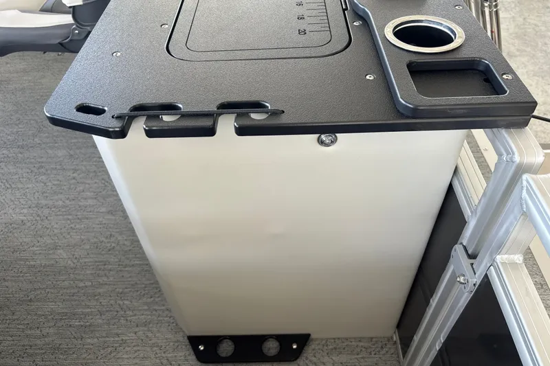 Slide: The Image of 2026 Sun Tracker Fishin' Barge 20 DLX console with cup holder and storage compartment. - 27