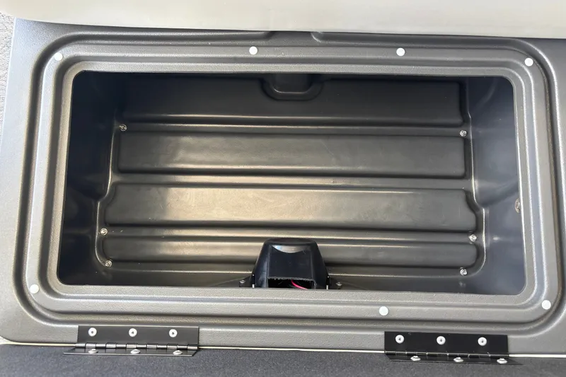 Slide: The Image of Open storage compartment on 2026 Sun Tracker Fishin' Barge 20 DLX boat. - 39