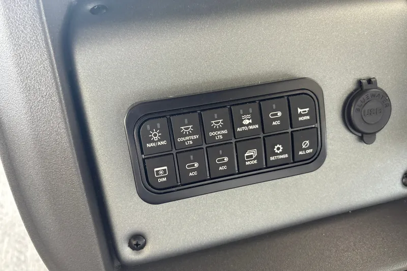 Slide: The Image of Control panel of 2026 Sun Tracker Fishin' Barge 20 DLX with various function buttons. - 22