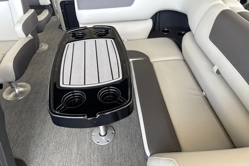 Slide: The Image of Interior of 2026 Sun Tracker Fishin' Barge 20 DLX with seating and table. - 16