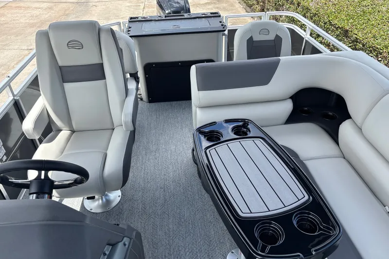 Slide: The Image of Interior of 2026 Sun Tracker Fishin' Barge 20 DLX with seating and table. - 15