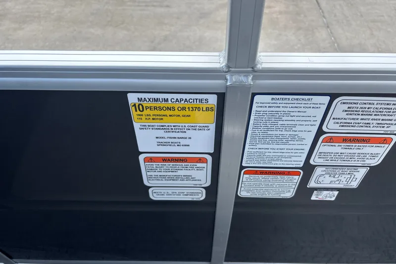 Slide: The Image of 2026 Sun Tracker Fishin' Barge 20 DLX capacity and safety labels on boat interior. - 42