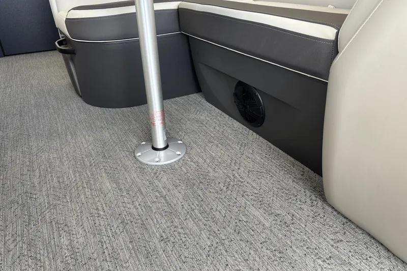 Slide: The Image of Interior seating of 2026 Sun Tracker Fishin' Barge 20 DLX with carpeted flooring. - 24