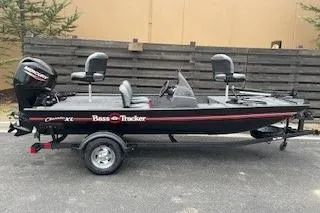 The Image of 2026 Tracker Bass Tracker Classic XL fishing boat on trailer, side view. - 0