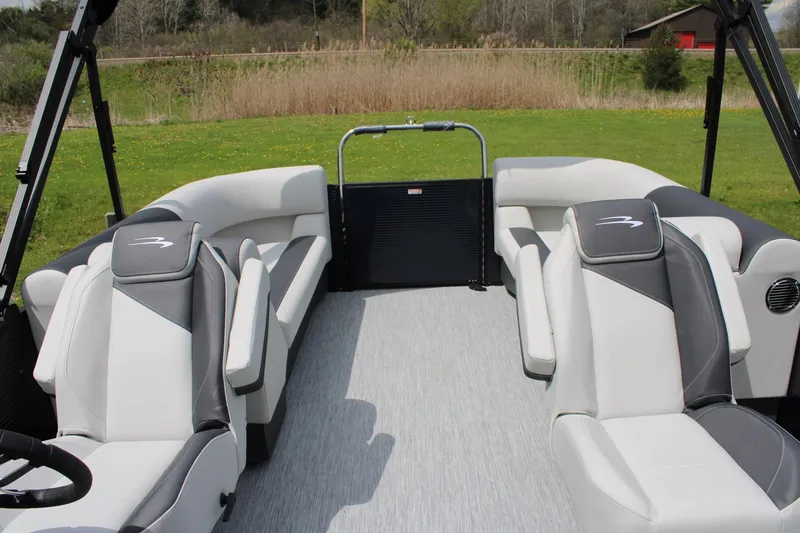 Slide: The Image of 2026 Bennington 22 SSRSF pontoon boat interior with plush seating and modern design. - 11