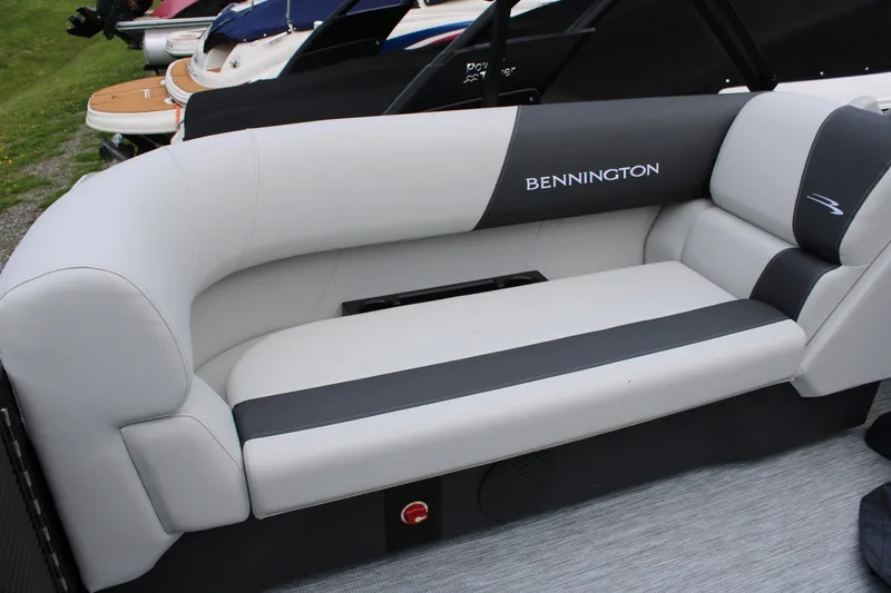 Slide: The Image of 2026 Bennington 22 SSRSF boat seating with sleek white and black upholstery. - 7