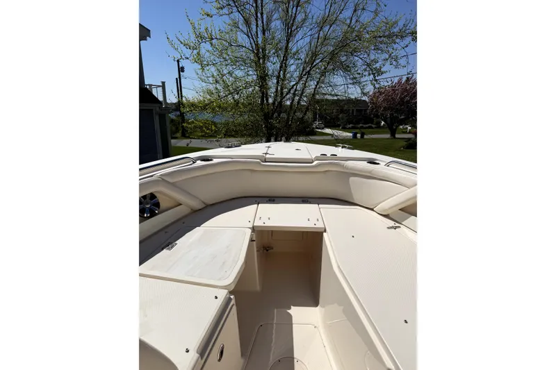 Slide: The Image of 2017 Grady White Freedom 335 boat interior with seating and storage compartments. - 10
