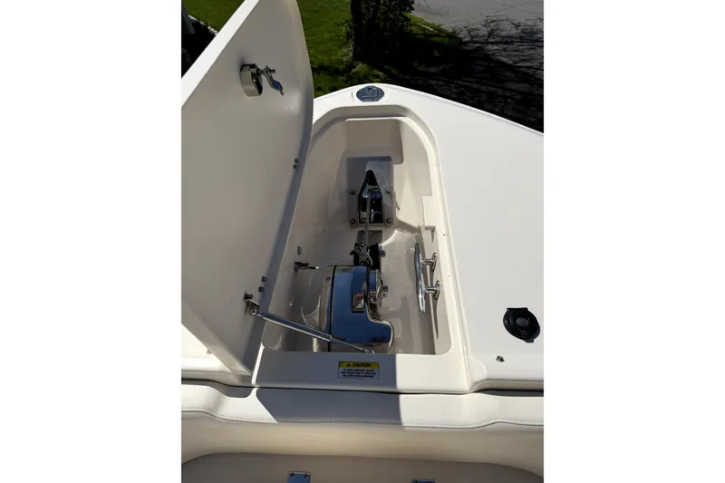 Slide: The Image of 2017 Grady White Freedom 335 boat anchor compartment with open hatch. - 17