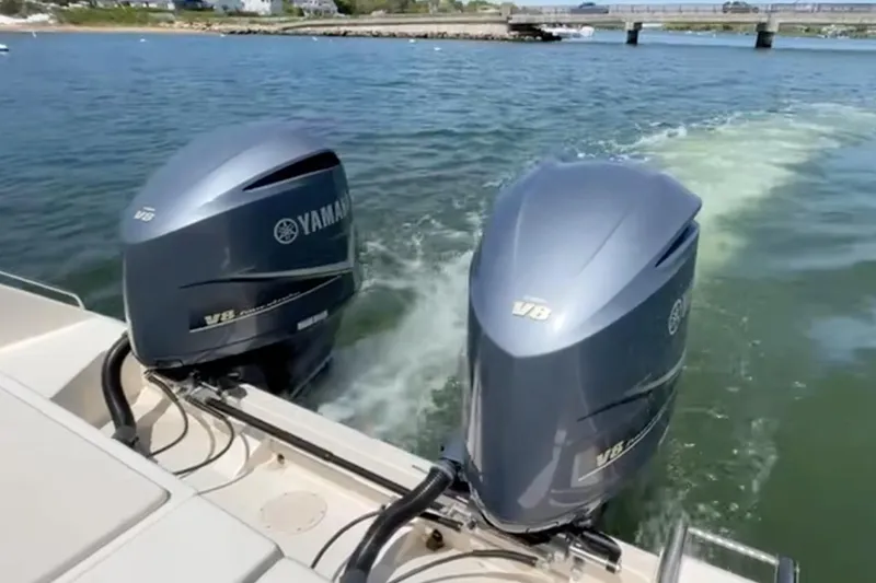 Slide: The Image of 2017 Grady White Freedom 335 with twin Yamaha V8 outboard engines on water. - 21