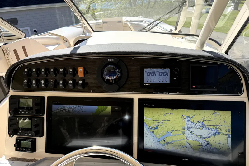 Slide: The Image of Dashboard of 2017 Grady White Freedom 335 boat with navigation and control systems. - 7