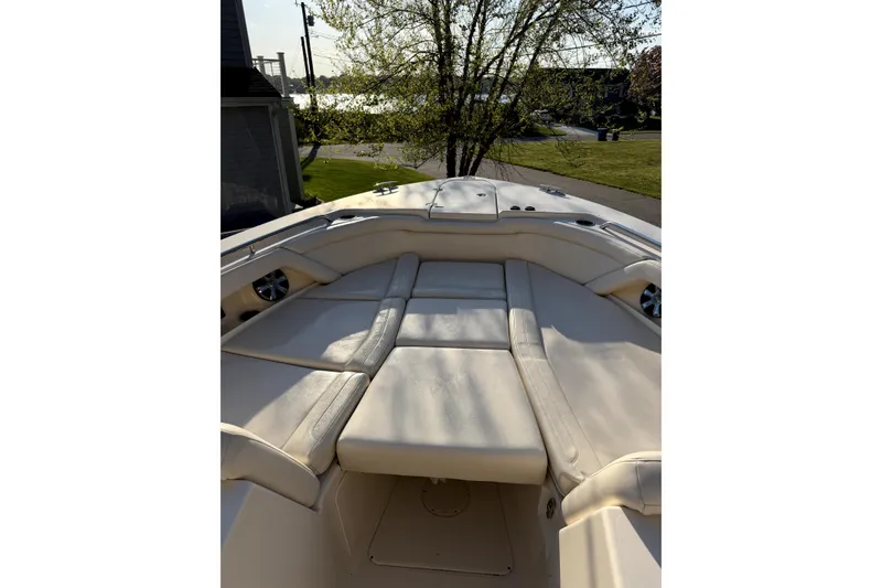 Slide: The Image of 2017 Grady White Freedom 335 boat interior with cushioned seating, outdoor setting. - 9