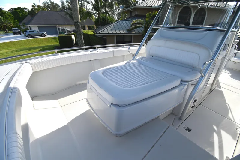 Slide: The Image of 2007 Glacier Bay 3065 Canyon Runner boat interior with white seating and spacious deck. - 26