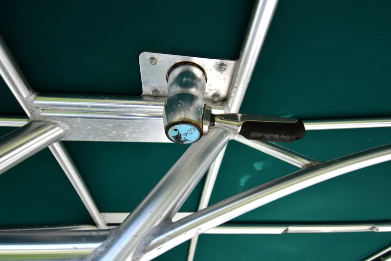 Slide: The Image of Close-up of a 2007 Glacier Bay 3065 Canyon Runner boat's metal framework and handle. - 28
