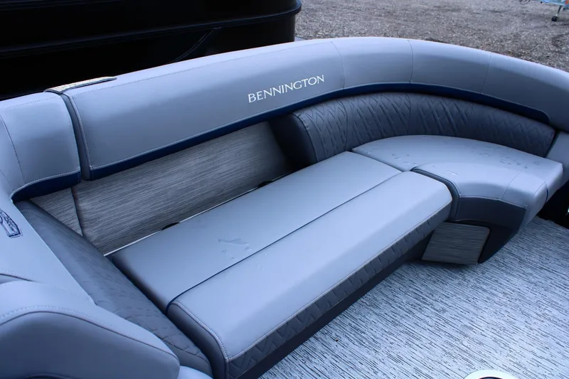 Slide: The Image of Luxurious seating on 2026 Bennington 24 MFBSF pontoon boat, featuring elegant gray upholstery. - 10