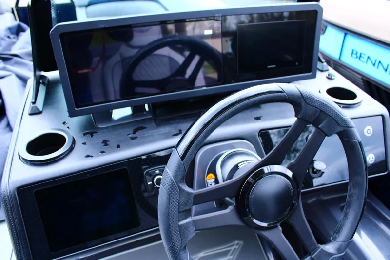 Slide: The Image of Steering console of 2026 Bennington 24 MFBSF boat with modern controls and displays. - 12