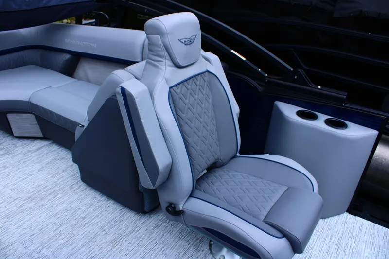 Slide: The Image of Luxurious seating on 2026 Bennington 24 MFBSF boat, featuring elegant gray upholstery. - 5