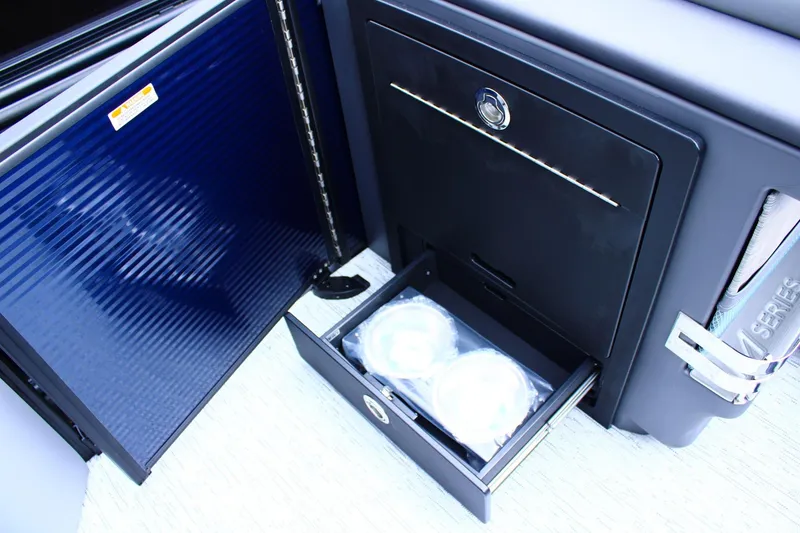 Slide: The Image of 2026 Bennington 24 MFBSF boat interior storage compartments and drawer detail. - 7
