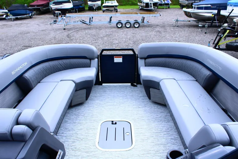 Slide: The Image of 2026 Bennington 24 MFBSF pontoon boat with spacious seating and modern design. - 9