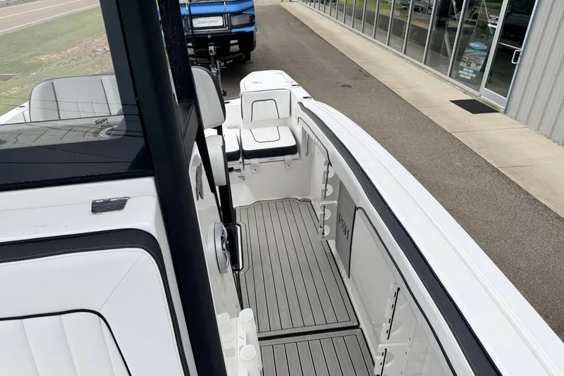 Slide: The Image of 2023 Yamaha Boats 255 FSH Sport E interior, showcasing sleek design and spacious layout. - 10