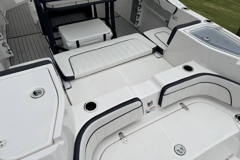 Slide: The Image of 2023 Yamaha Boats 255 FSH Sport E interior with seating and storage compartments. - 6