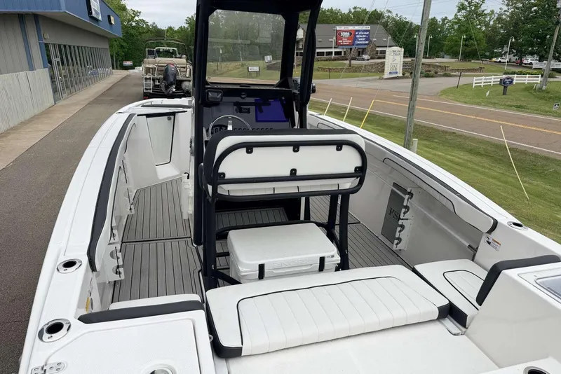 Slide: The Image of 2023 Yamaha Boats 255 FSH Sport E interior, showcasing seating and helm station. - 7