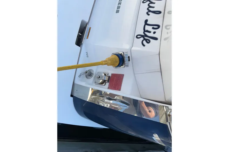 Slide: The Image of Rear view of a 2017 Regal 28 Express boat with power connection. - 17