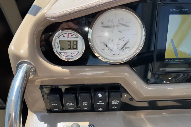Slide: The Image of Dashboard of a 2017 Regal 28 Express boat with gauges and controls. - 32