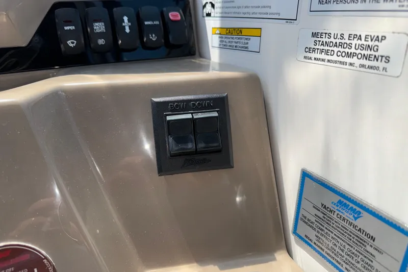 Slide: The Image of Control panel of a 2017 Regal 28 Express boat with various switches and labels. - 34