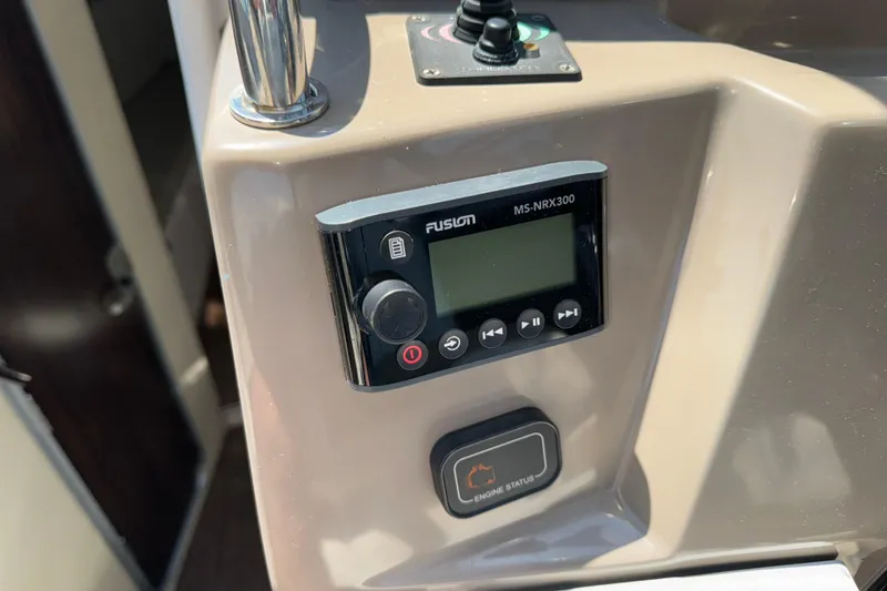 Slide: The Image of Fusion MS-NRX300 stereo control on 2017 Regal 28 Express boat dashboard. - 35