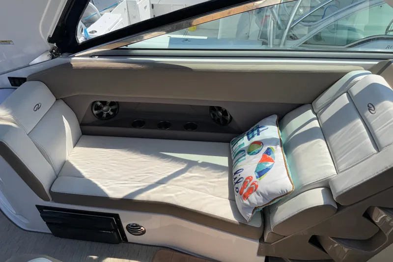 Slide: The Image of Luxurious interior seating of a 2017 Regal 28 Express boat with decorative pillow. - 40