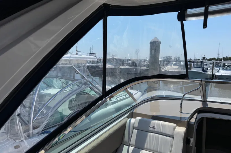 Slide: The Image of 2017 Regal 28 Express boat interior with marina view through clear windows. - 41