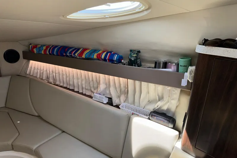 Slide: The Image of Interior of 2017 Regal 28 Express boat with seating and storage area. - 54