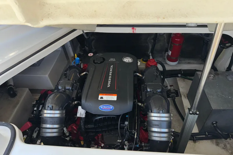 Slide: The Image of Engine compartment of a 2017 Regal 28 Express boat featuring a Volvo Penta engine. - 55