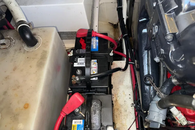 Slide: The Image of Battery compartment of a 2017 Regal 28 Express boat, featuring Seahawk battery. - 58