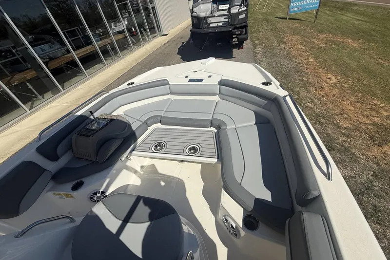 Slide: The Image of 2023 NauticStar 211 Hybrid boat interior with gray seating and cup holders. - 3