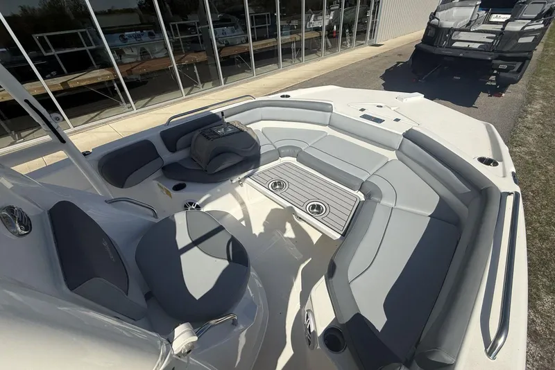 Slide: The Image of 2023 NauticStar 211 Hybrid boat interior with gray seating and cup holders. - 4