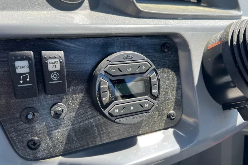 Slide: The Image of 2026 Starcraft GX 22 R DH dashboard with stereo and control panel. - 10