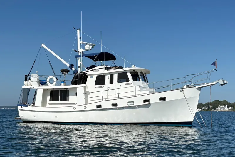 The Image of 2009 Kadey-Krogen yacht on calm water under clear blue sky. - 0