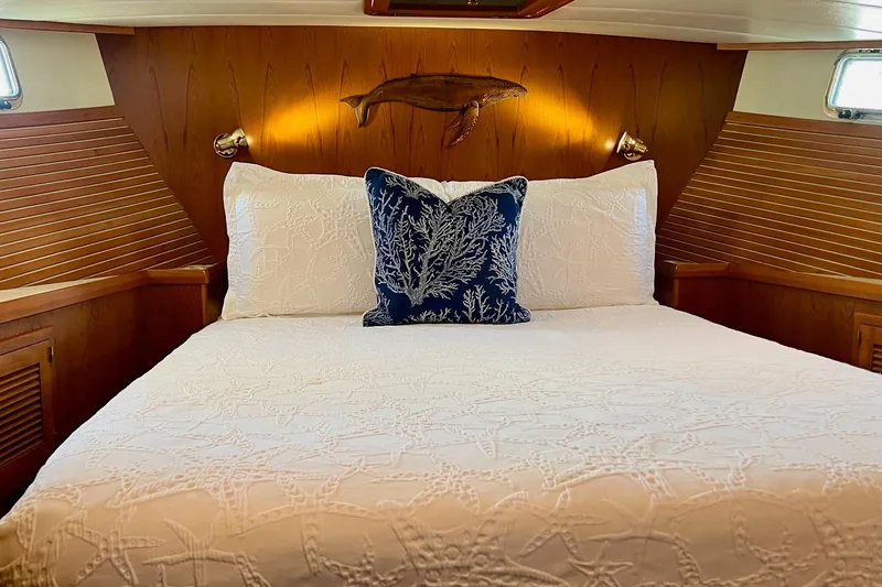 Slide: The Image of Luxurious 2009 Kadey-Krogen yacht bedroom with elegant bedding and nautical decor. - 10