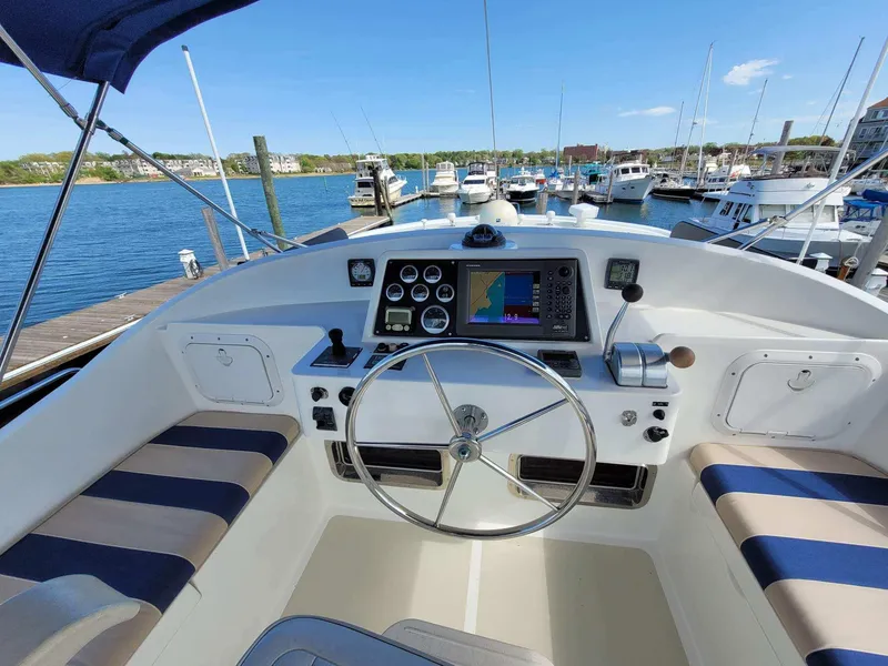 Slide: The Image of Helm of a 2009 Kadey-Krogen 44 yacht in the marina. - 16