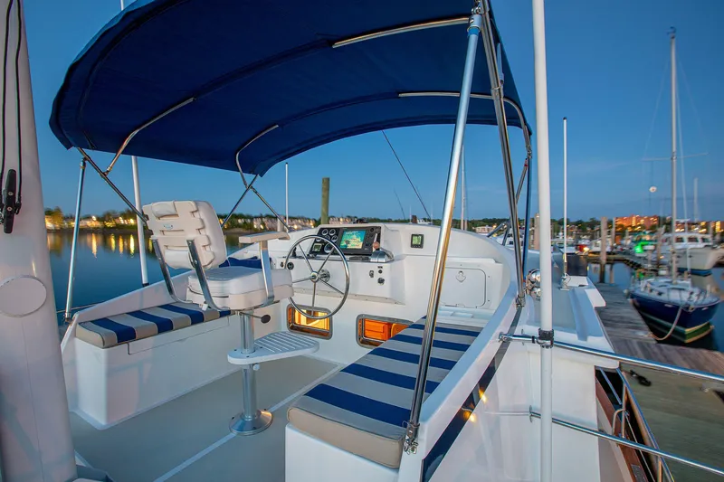 Slide: The Image of 2009 Kadey-Krogen 44 yacht cockpit at sunset in harbor. - 18