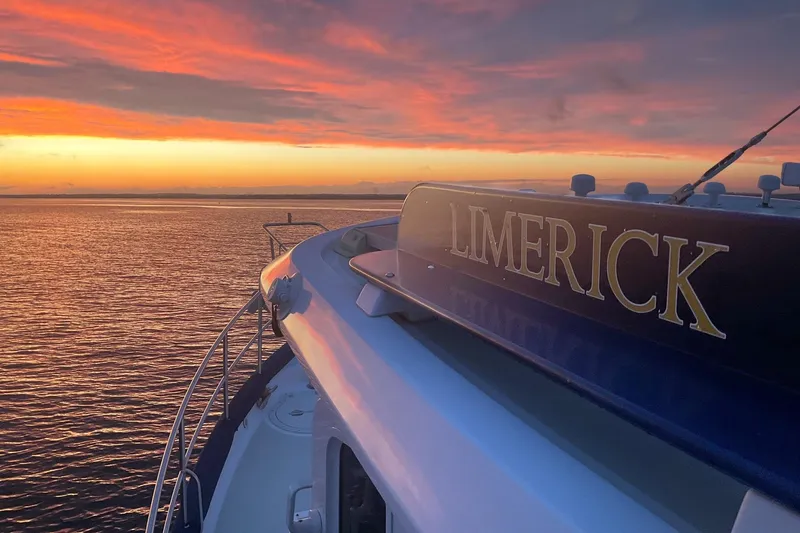 Slide: The Image of Kadey-Krogen yacht "Limerick" at sunset, 2009 model, on calm waters. - 26
