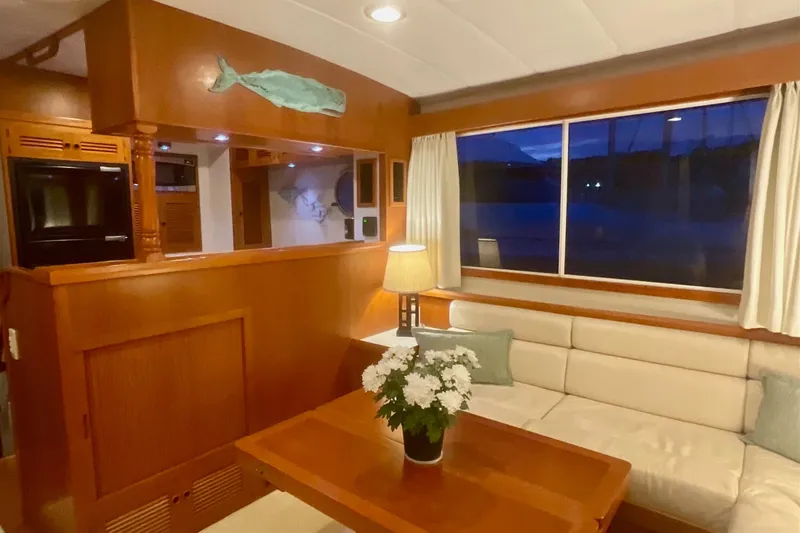 Slide: The Image of Luxurious 2009 Kadey-Krogen yacht interior with cozy seating, wooden finishes, and elegant decor. - 6
